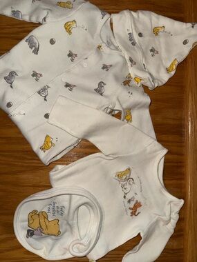 Disney Cream One-Piece Bodysuits with Yellow and Gray Character Prints